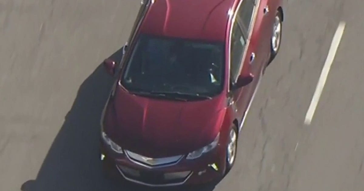 Man in red car leads half-hour police chase across Los Angeles.