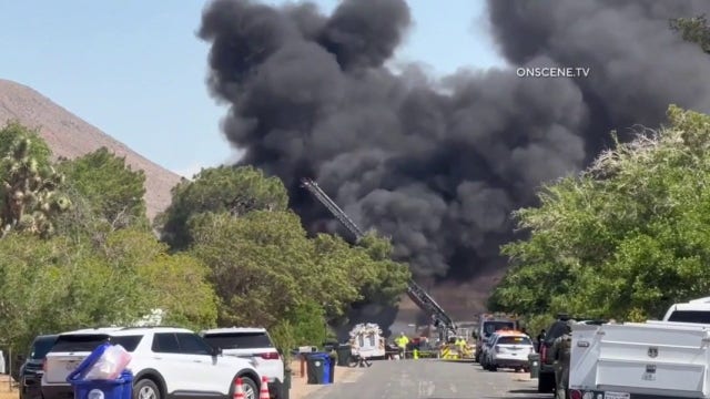 Woman sets Apple Valley home on fire after stabbing man, police say