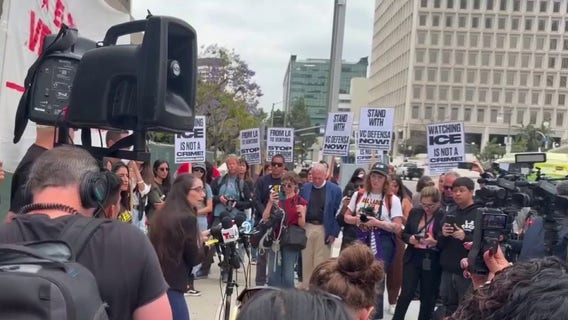 Anti-ICE activists rally in downtown LA after federal search warrants target organizers