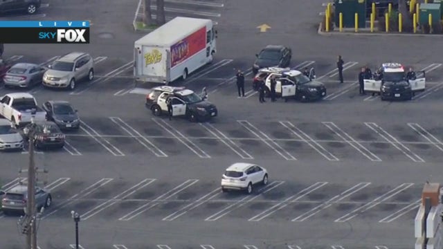 Armed suspect in standoff with LAPD officers in South Los Angeles shopping center