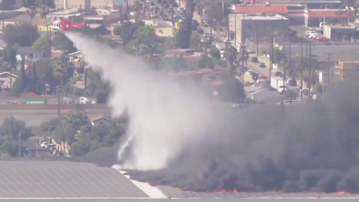 Massive fire erupts at Boyle Heights warehouse; ammonia leak suspected