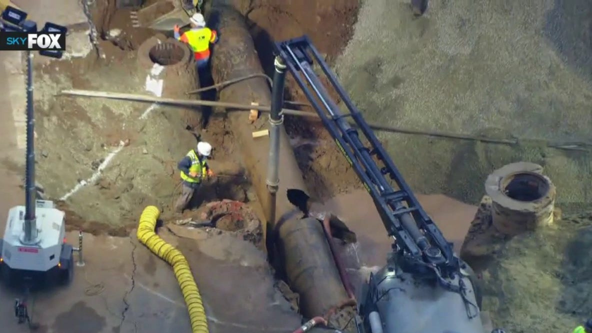 Repairs underway after century-old water main burst floods West Hollywood, opening sinkhole