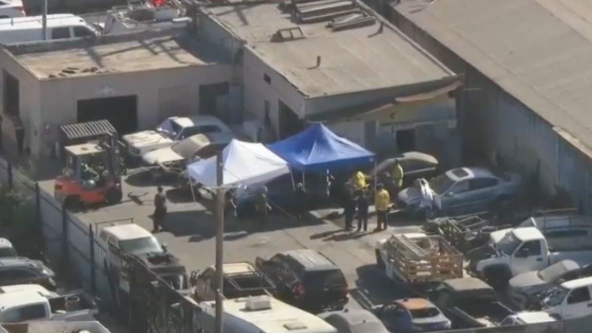 3 charged with premeditated murder after body found in burned car at South LA tow yard