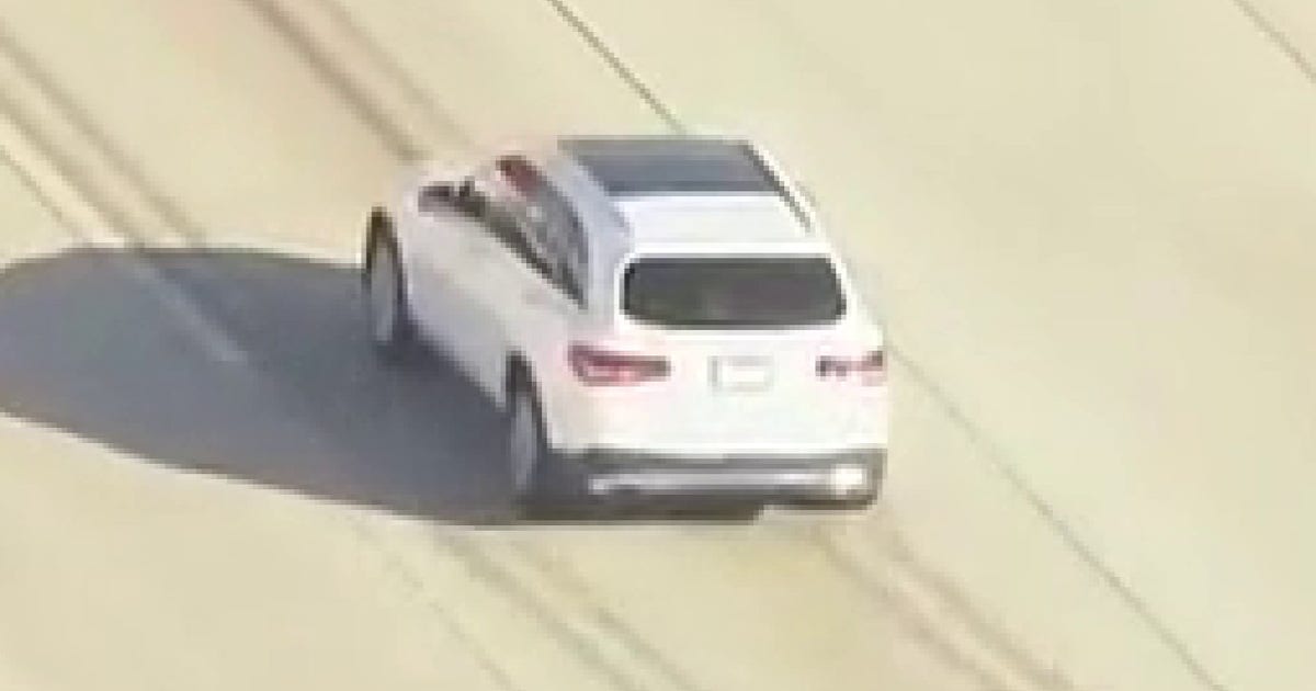 LA police chase underway involving suspect possibly carrying gun