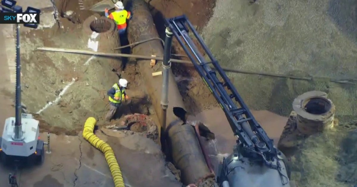Repairs underway after century-old water main burst floods West Hollywood, opening sinkhole
