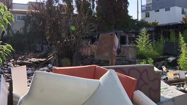 Family says squatters still plague property four months after devastating fire