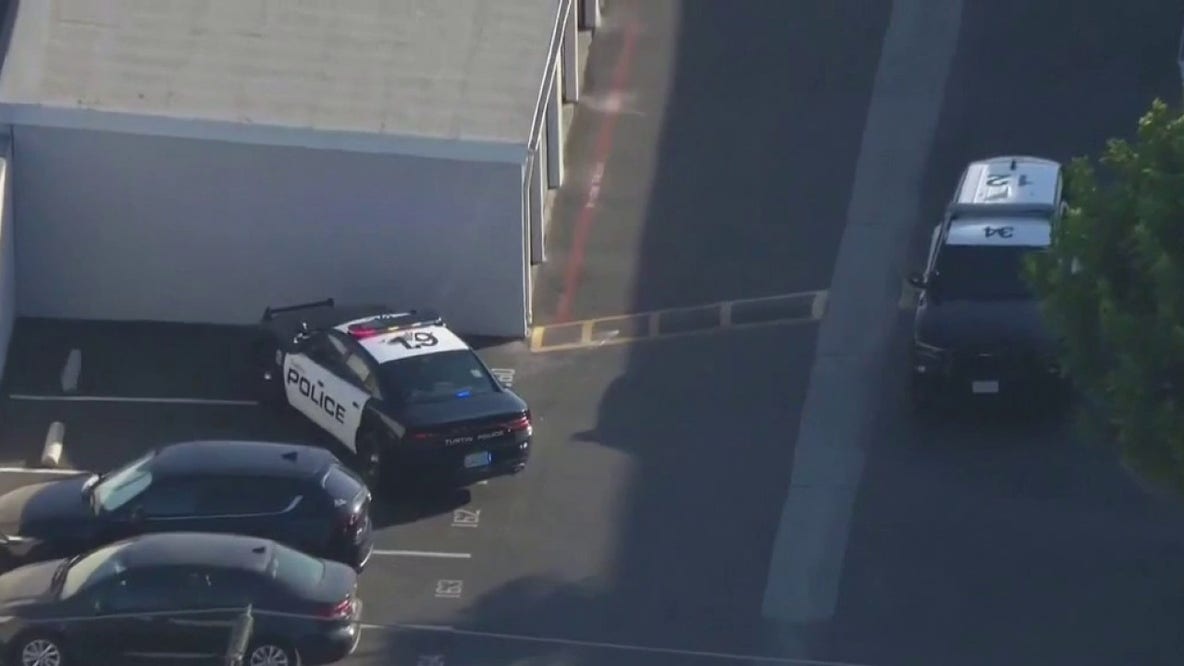 Tustin officer shoots knife-wielding suspect after discovering woman's body in home, police say