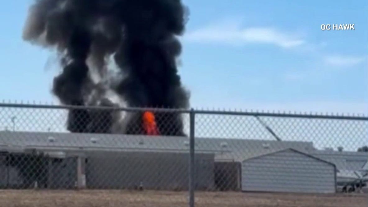 Fullerton warehouse fire briefly shuts down nearby municipal airport; No one hurt