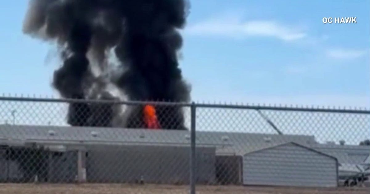 Fullerton warehouse fire briefly shuts down nearby municipal airport; No one hurt