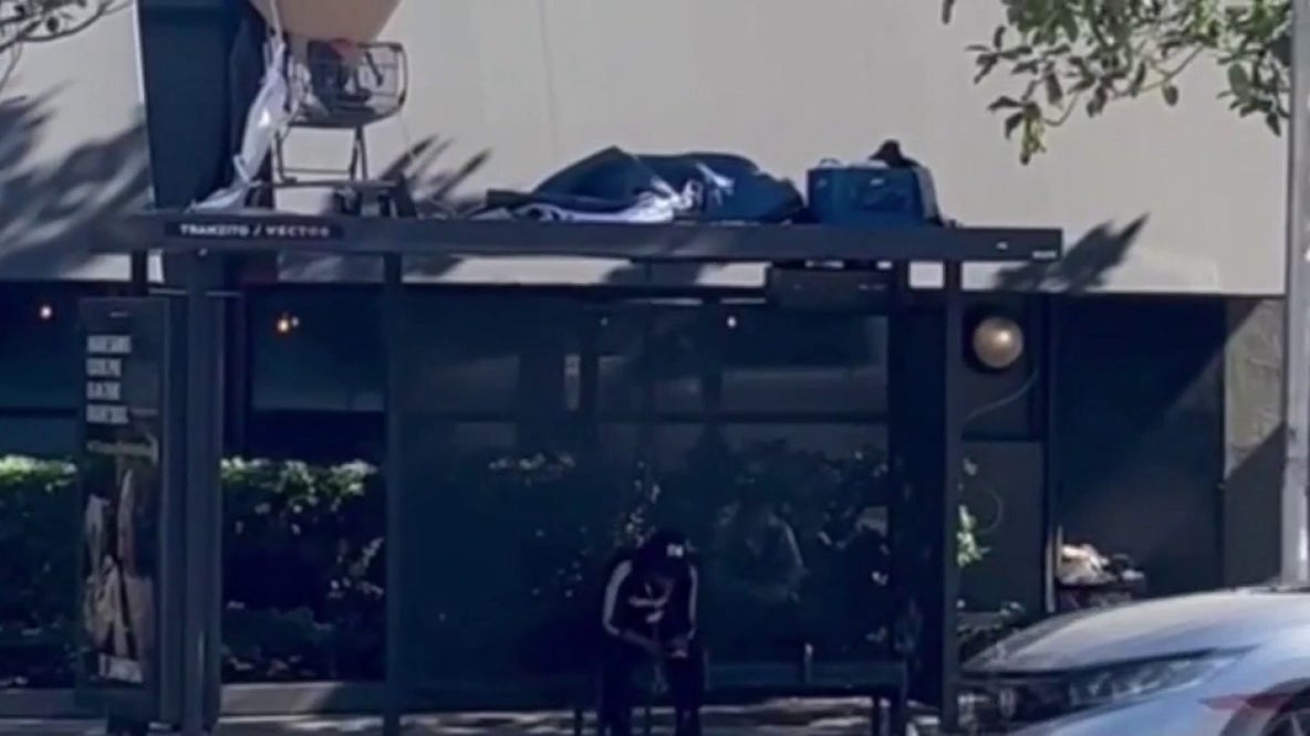 Homeless encampment spotted on top of Los Angeles bus stop