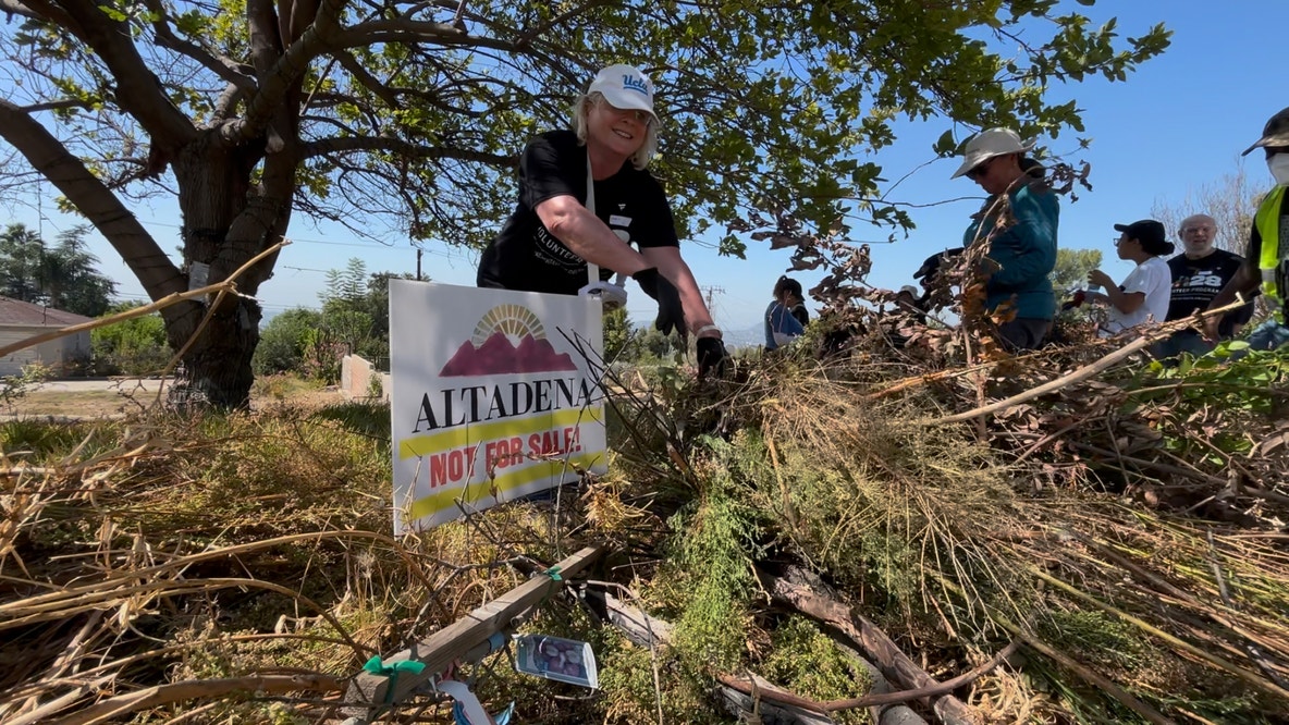 Volunteers clear brush in Altadena as 9/11 Day of Service events continue