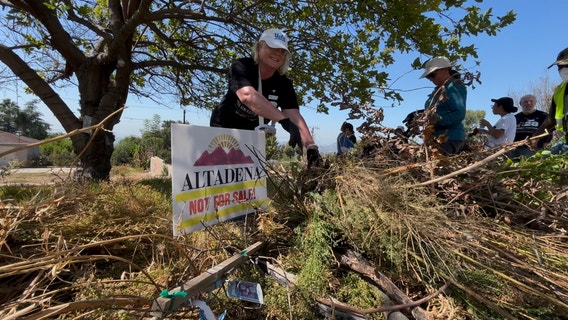 Volunteers clear brush in Altadena as 9/11 Day of Service events continue