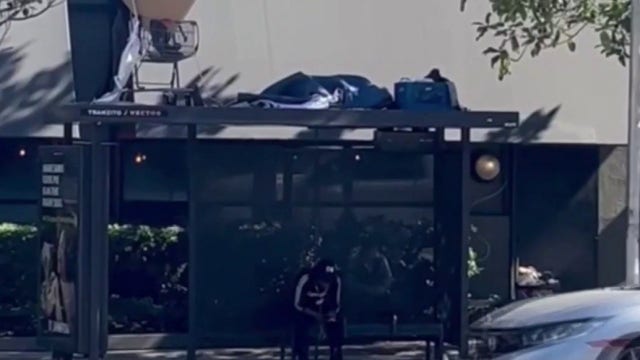 Homeless encampment spotted on top of Los Angeles bus stop