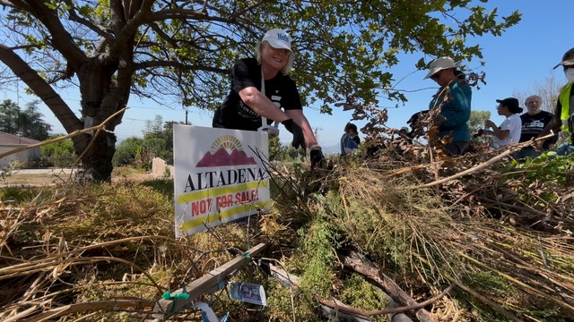Volunteers clear brush in Altadena as 9/11 Day of Service events continue
