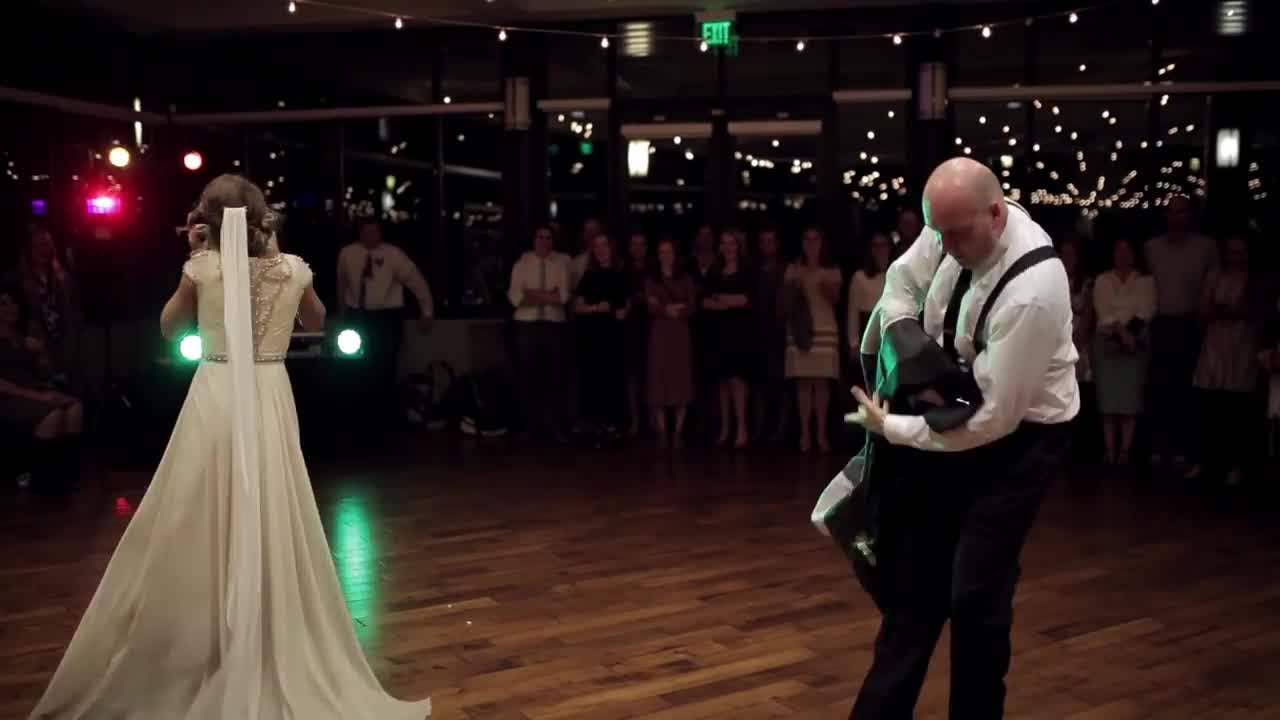 Bride and father surprise wedding guests with awesome dance