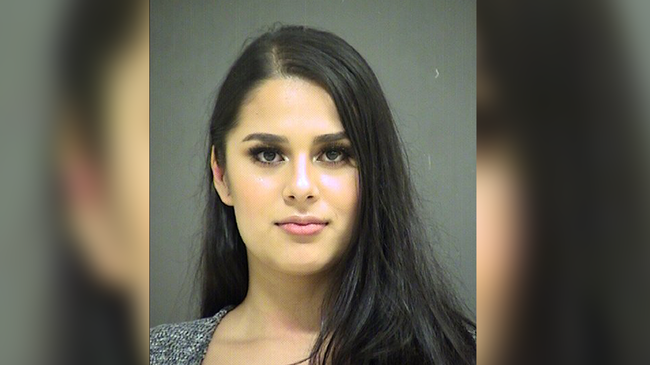Woman arrested for allegedly pouring alcohol into mouth of Taco Bell employee from car in drive-thru