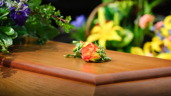 'Distraught and hysterical': Family sues after loved one's casket opens and corpse falls out