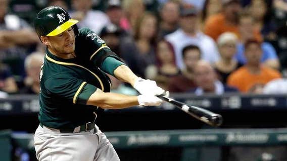 Valencia's 2 homers lead A's over fading Astros 4-3