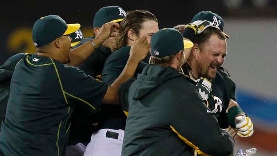 A's help Giants; edge Dodgers 5-4 in 10