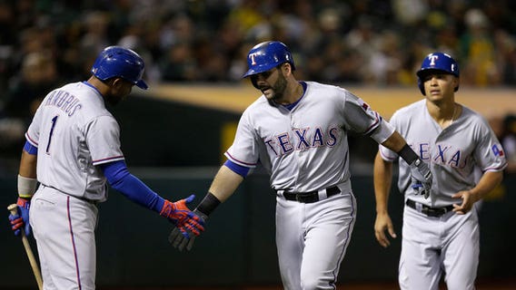 Rangers rally to beat A's 8-6