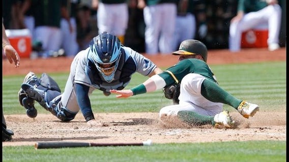 A's ride seventh inning rally to beat Rays 8-2