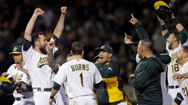 Davis beats out infield single in 10th as A's top Blue Jays