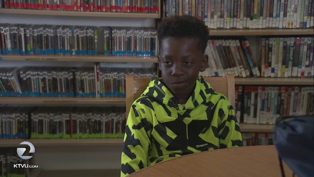 8-YO and mom hand out supplies to Oakland's homeless