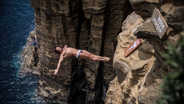 Diver rolls back years with cliff diving victory