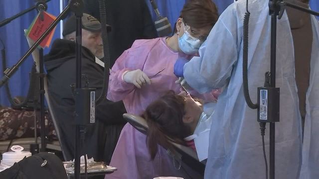 Patients line up early for free dental care at Solano County Fairgrounds