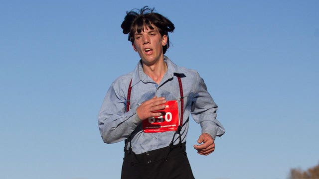 Amish man runs marathon in traditional slacks and suspenders