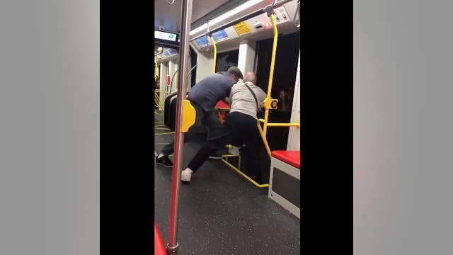 Video shows men trying to throw boy off Muni train for apparently playing loud music