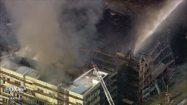 Massive fire rips through West Oakland townhome complex under construction