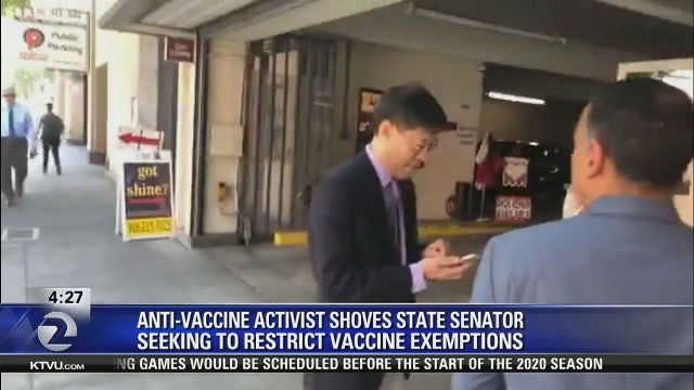 Anti-vaccine activist shoves California lawmaker