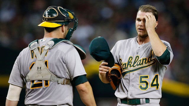 Passed balls cost A's in 6-4 loss to Diamondbacks