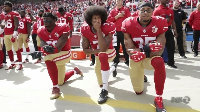 NFL, players push pause on controversial anthem rules for now