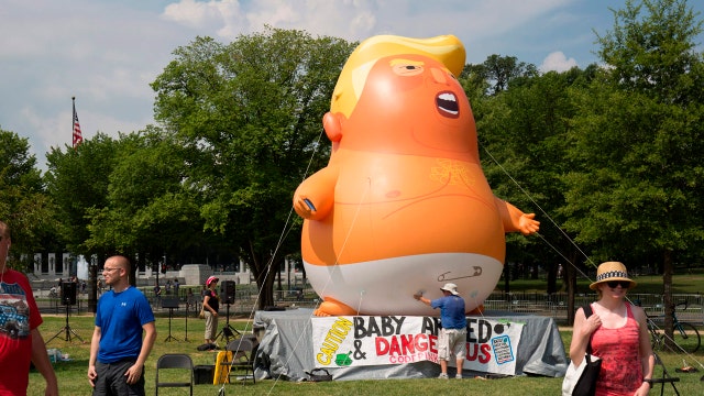 Drenched Trump supporters, protesters mark July 4 in DC