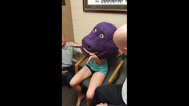 Teen ends up at fire department, stuck in Barney costume head