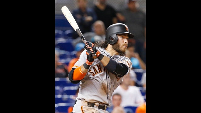 Crawford 1st with 7 hits since '75, Giants win in 14 innings