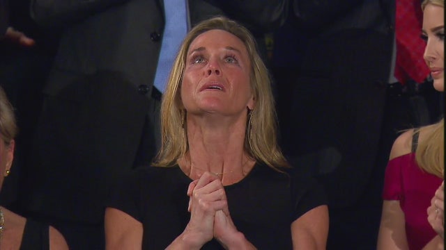 In emotional moment, Trump salutes slain SEAL's wife