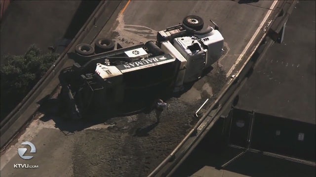 Cement truck overturns on Central Freeway connector in San Francisco, debris below