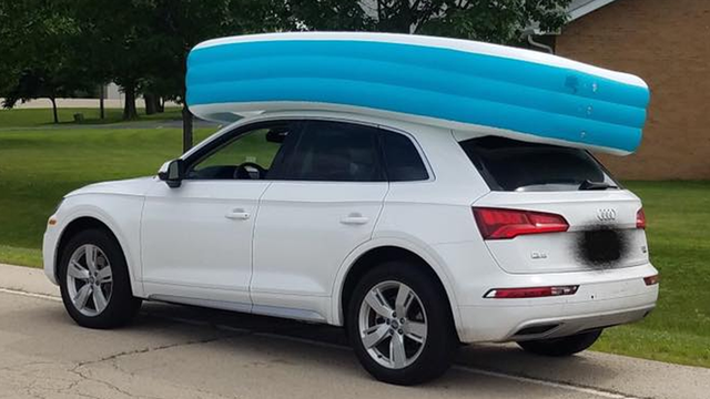 Mom arrested after letting children ride in an inflatable pool on top of a vehicle