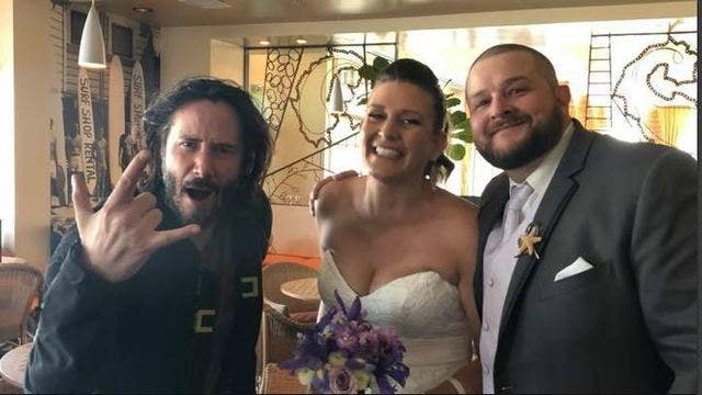 Keanu Reeves poses for photo with bride and groom ahead of Santa Cruz ceremony