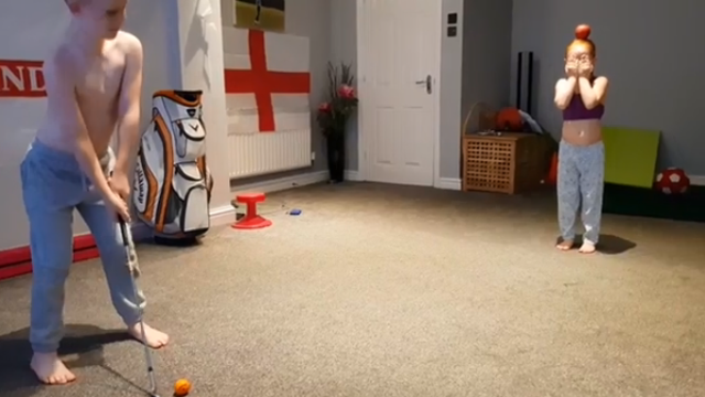 That Kid's Got Game: 8-year-old trick shot golfer hits apple off younger sister's head