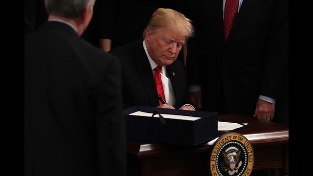 Trump signs bipartisan measure to confront opioid crisis