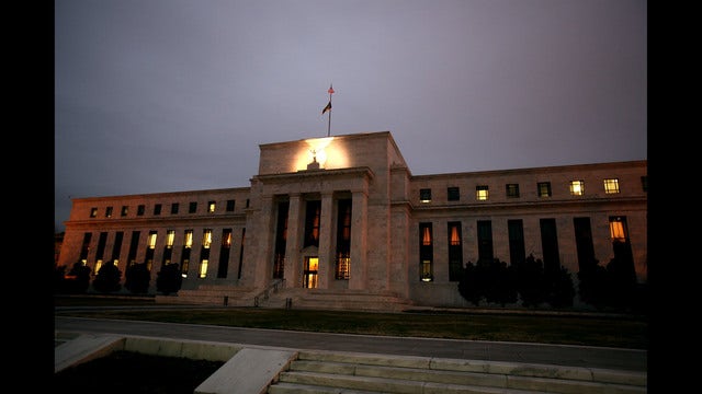 Fed leaves key rate unchanged but hints at future hikes