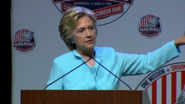 Clinton shrugs off Trump shakeup, attacks his tax plan