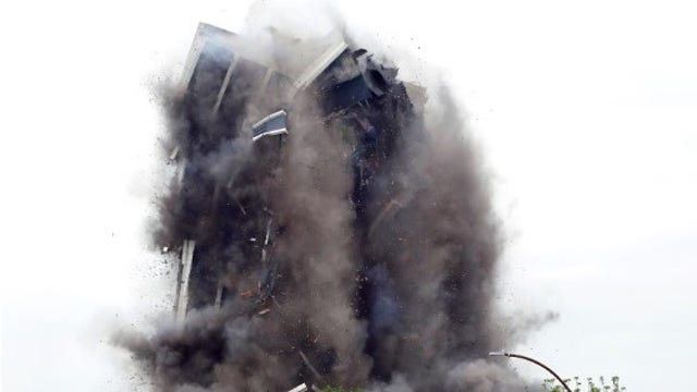 Defunct steelmaker's 21-story headquarters imploded Sunday