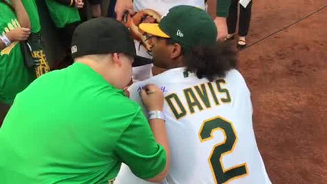 Oakland A's Khris Davis lets Make-A-Wish kid sign jersey, slugs long HR