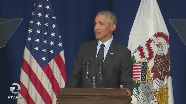 Obama scorches Trump in return to campaign trail