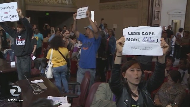 Oakland City Council meeting interrupted by protests, audience approves